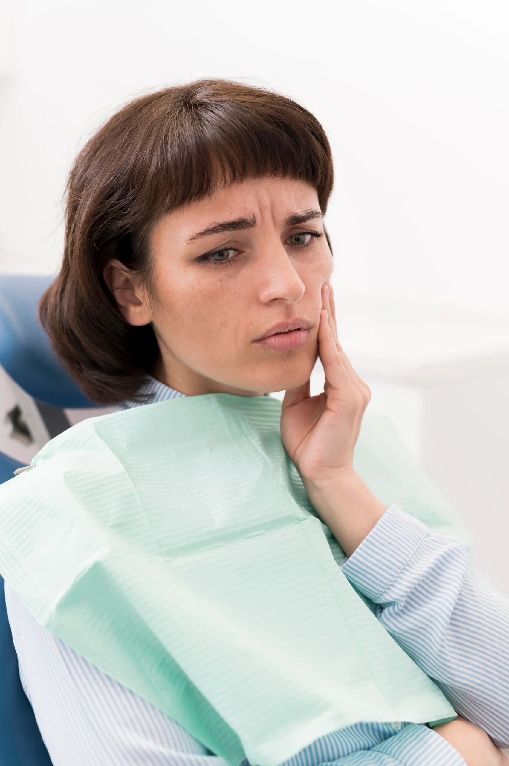 female-patient-having-toothache-dentist-s-office
